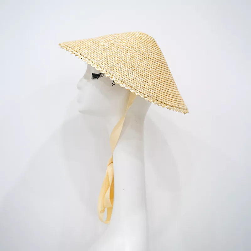 Chic straw sun hat with scalloped edge and yellow tie.