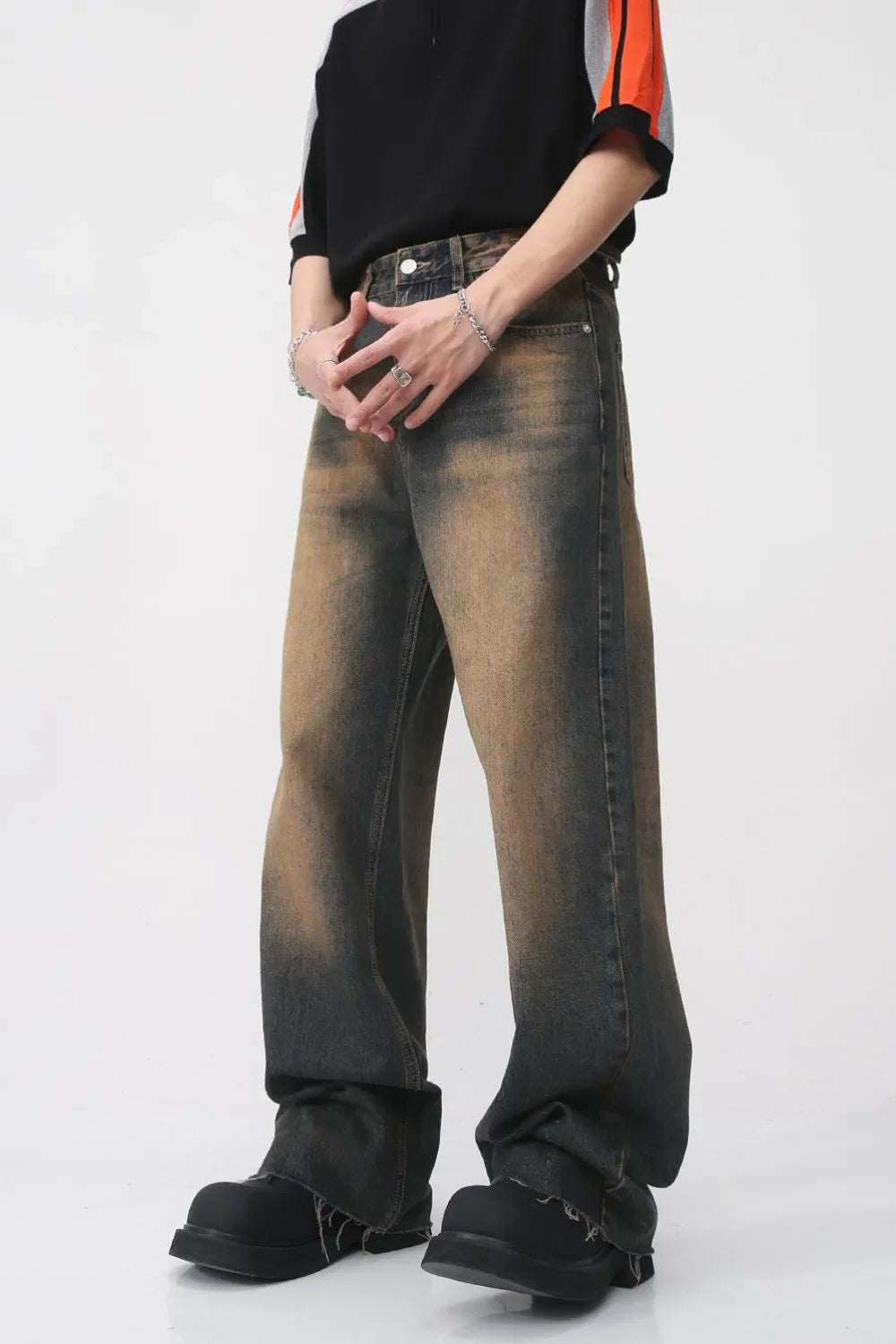 Faded wash wide leg jeans in dark denim with a distressed, ombre effect.