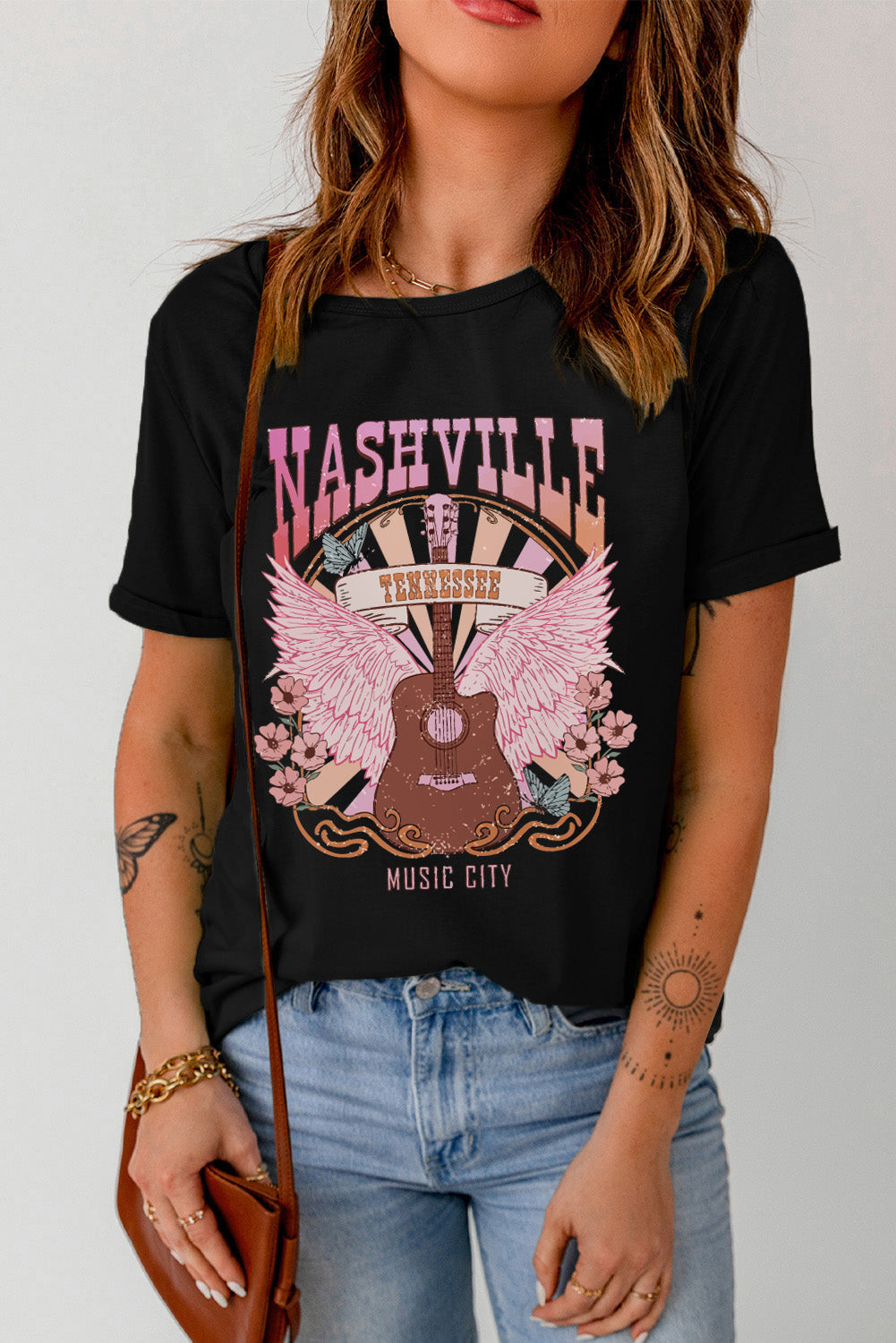 Black graphic tee with Nashville Wings and guitar design