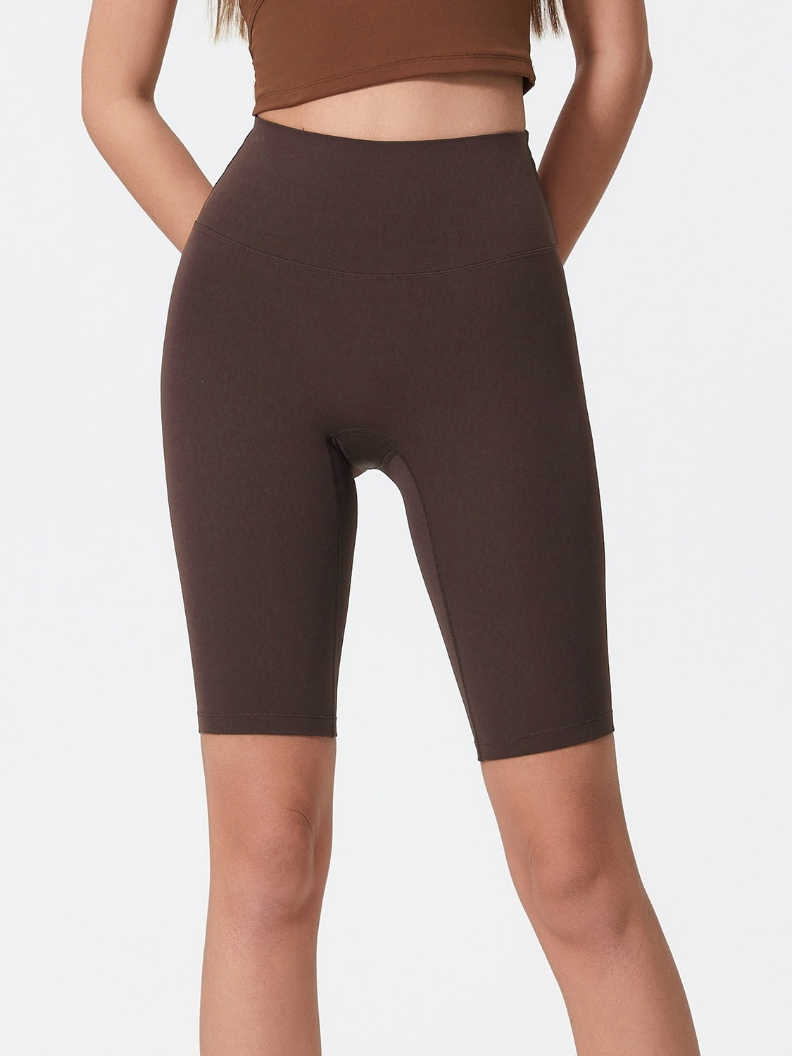 Sculpted Contour Active Cycling Shorts in Dark Brown, high-waisted, mid-thigh length, athletic fit.