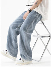 Light blue vintage wash wide-leg jeans with distressed details.
