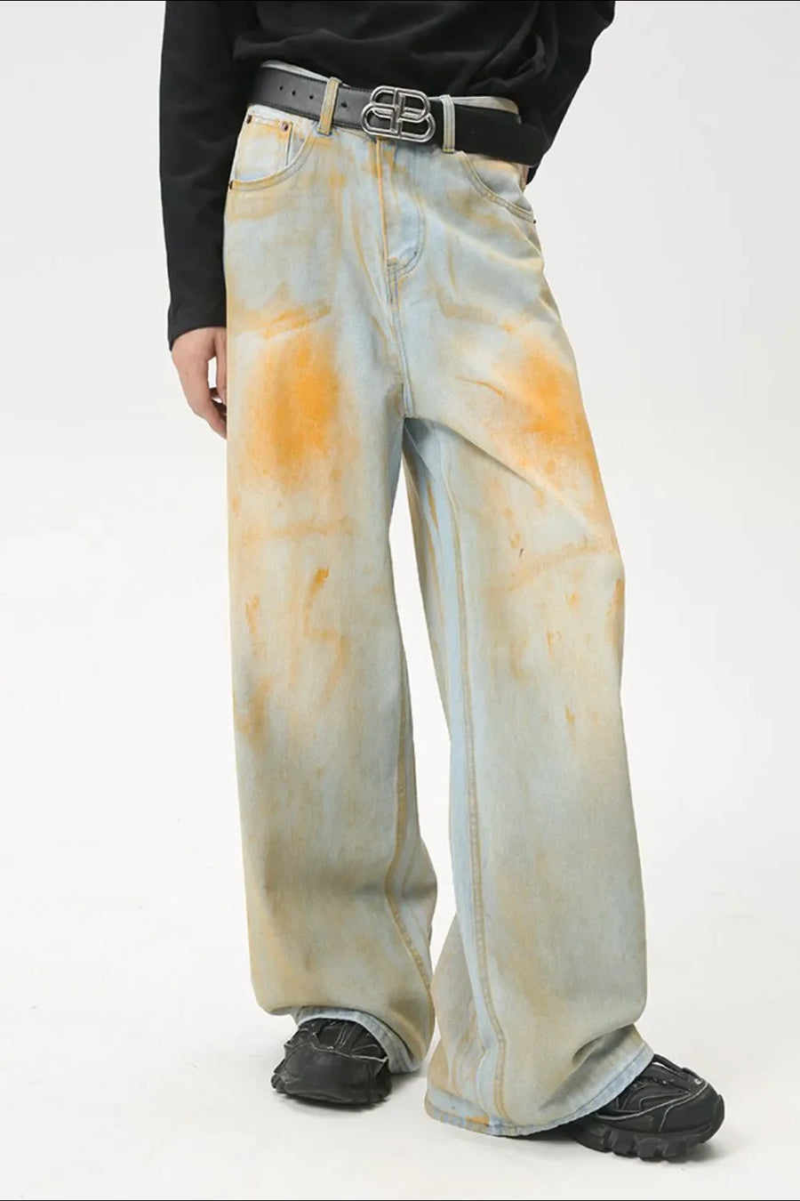 Light acid wash palazzo jeans with orange marbling and a relaxed fit.
