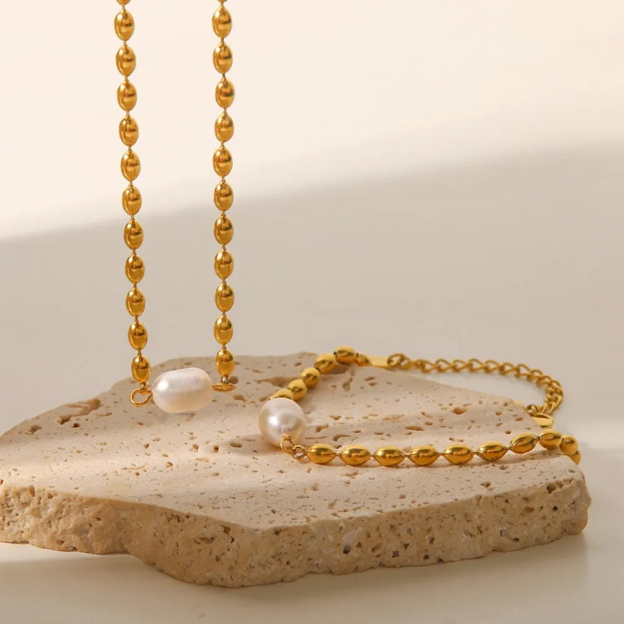Synthetic Pearl, Stainless Steel, Titanium Steel Care instructions: Avoid wearin jewelry set in ivory with delicate