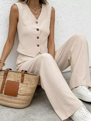 Chic beige button-down vest and flowing wide-leg pants set with textured fabric.
