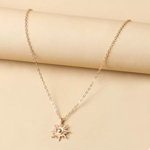 Gold sunburst pendant necklace with delicate chain, 18K gold-plated, boho style.