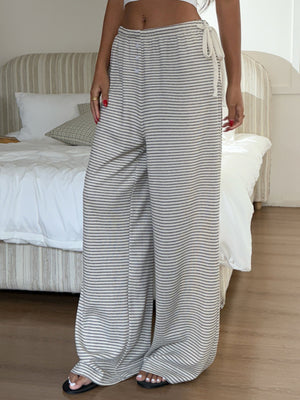 cream wide-leg pants with full-length and drawstring