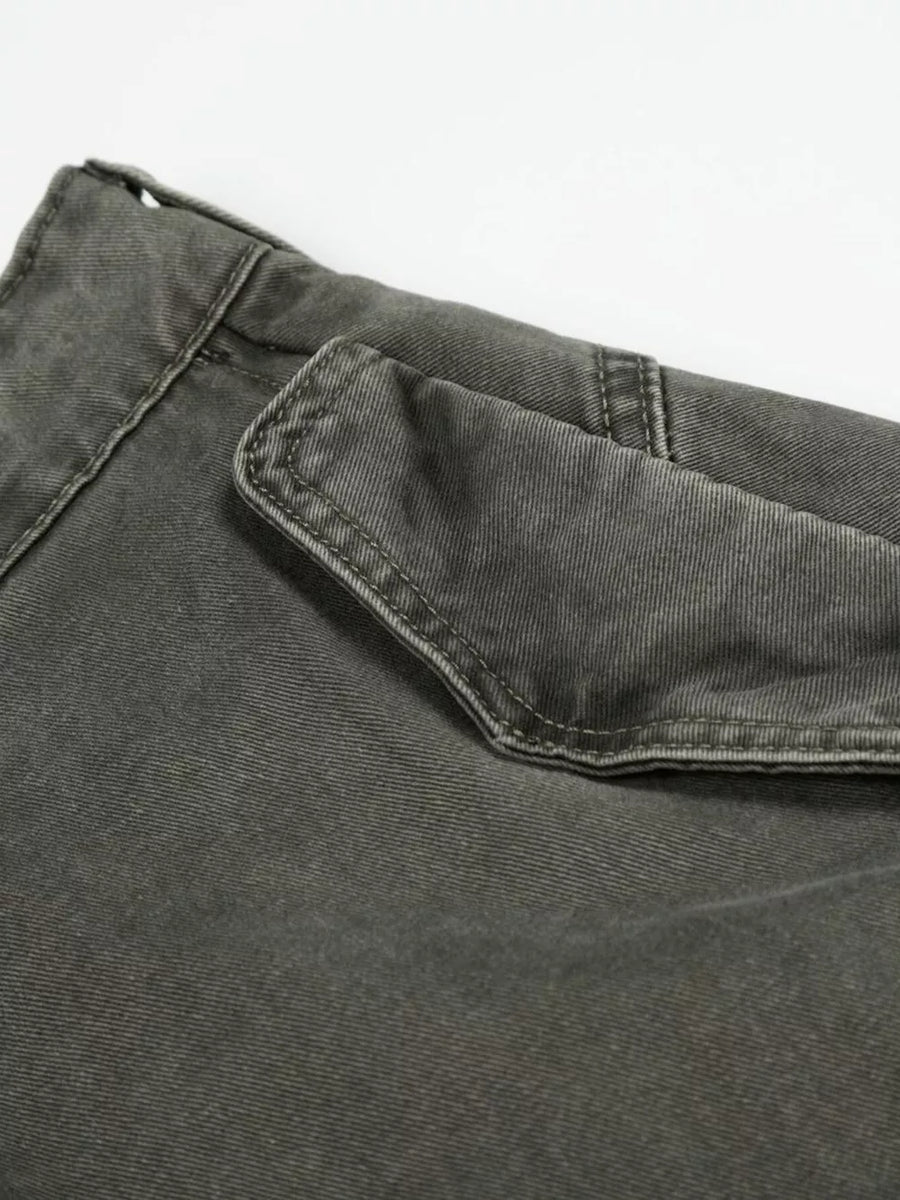 Grey wide-leg cargo pants with a visible flap pocket detail.