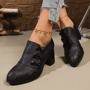 Black woven button-detail high heels with a textured finish.