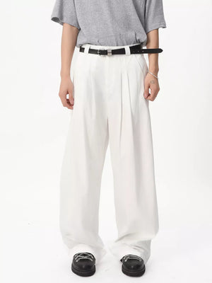 Relaxed wide-leg white sweatpants with front pleats and a black belt.