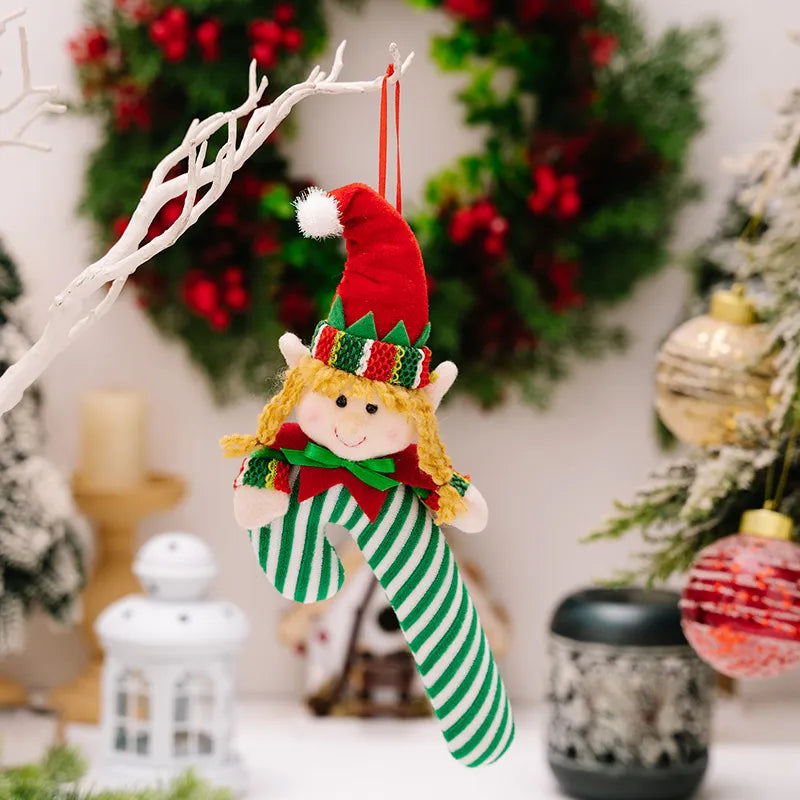 Elf candy cane ornament with red hat and green & white stripes.
