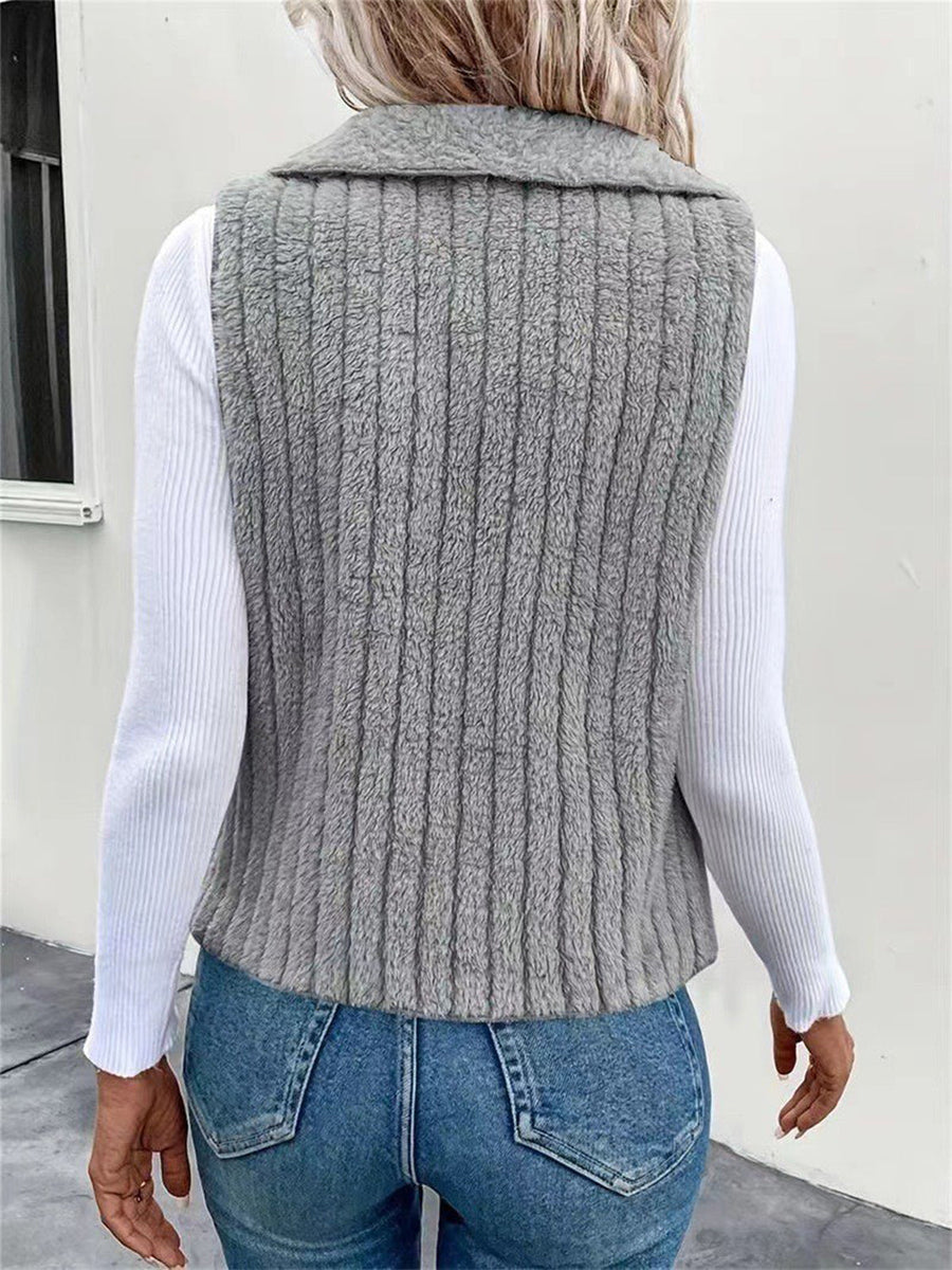 Textured teddy collarless vest in gray with vertical ribbing detail.