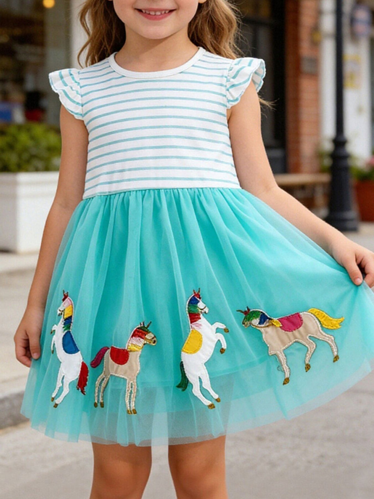 Toddler girls' turquoise tulle dress with embroidered unicorns and striped cotton top.