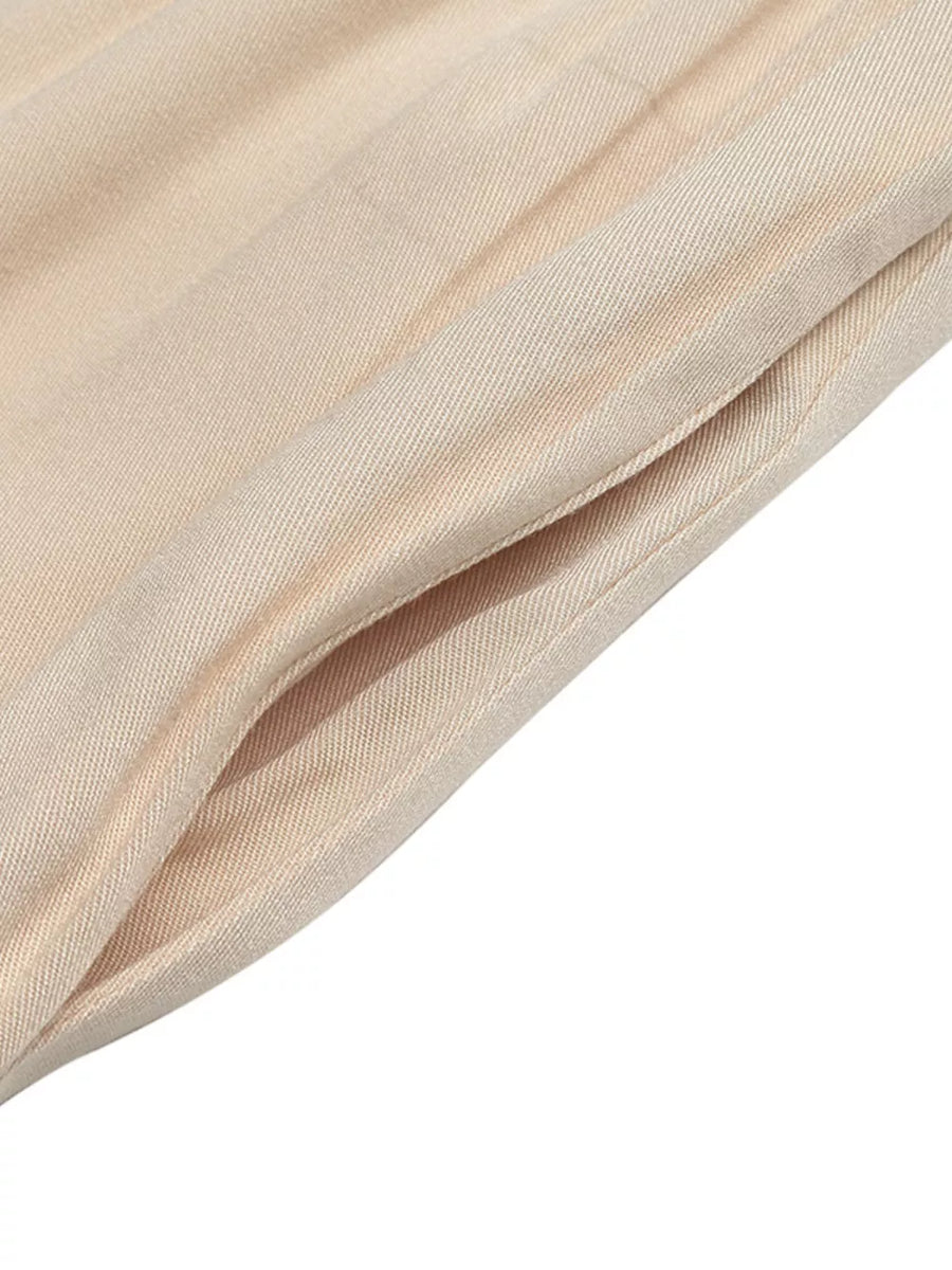 Apricot smocked tie shoulder wide-leg romper with pocket detail