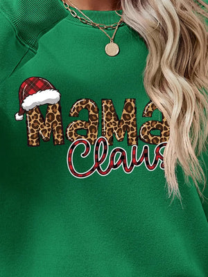 Green crewneck sweatshirt with leopard print Mama Claus graphic and Santa hat detail.