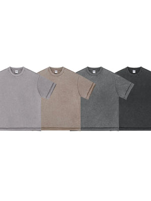 Washed cotton tee with raw edges in black, mocha, gray, and dark gray.