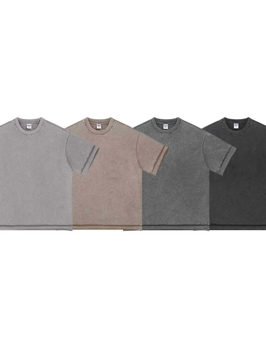 Washed cotton tee with raw edges in black, mocha, gray, and dark gray.