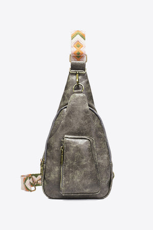 Gray textured sling bag with woven strap detail and front zip pocket