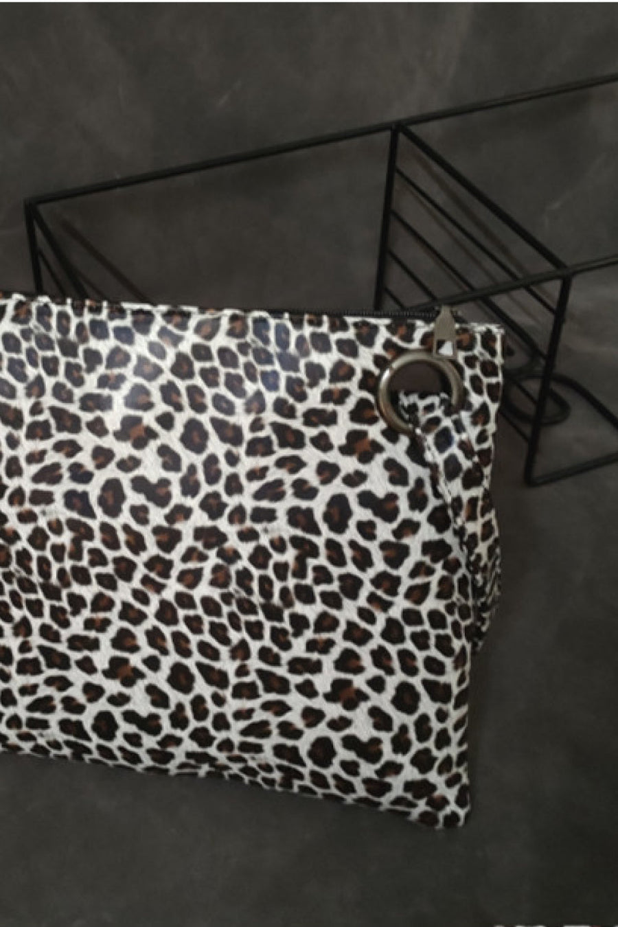 Leopard print clutch bag with zip top and ring detail