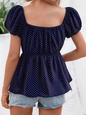 Navy polka dot peplum shirt with puff sleeves and square neckline