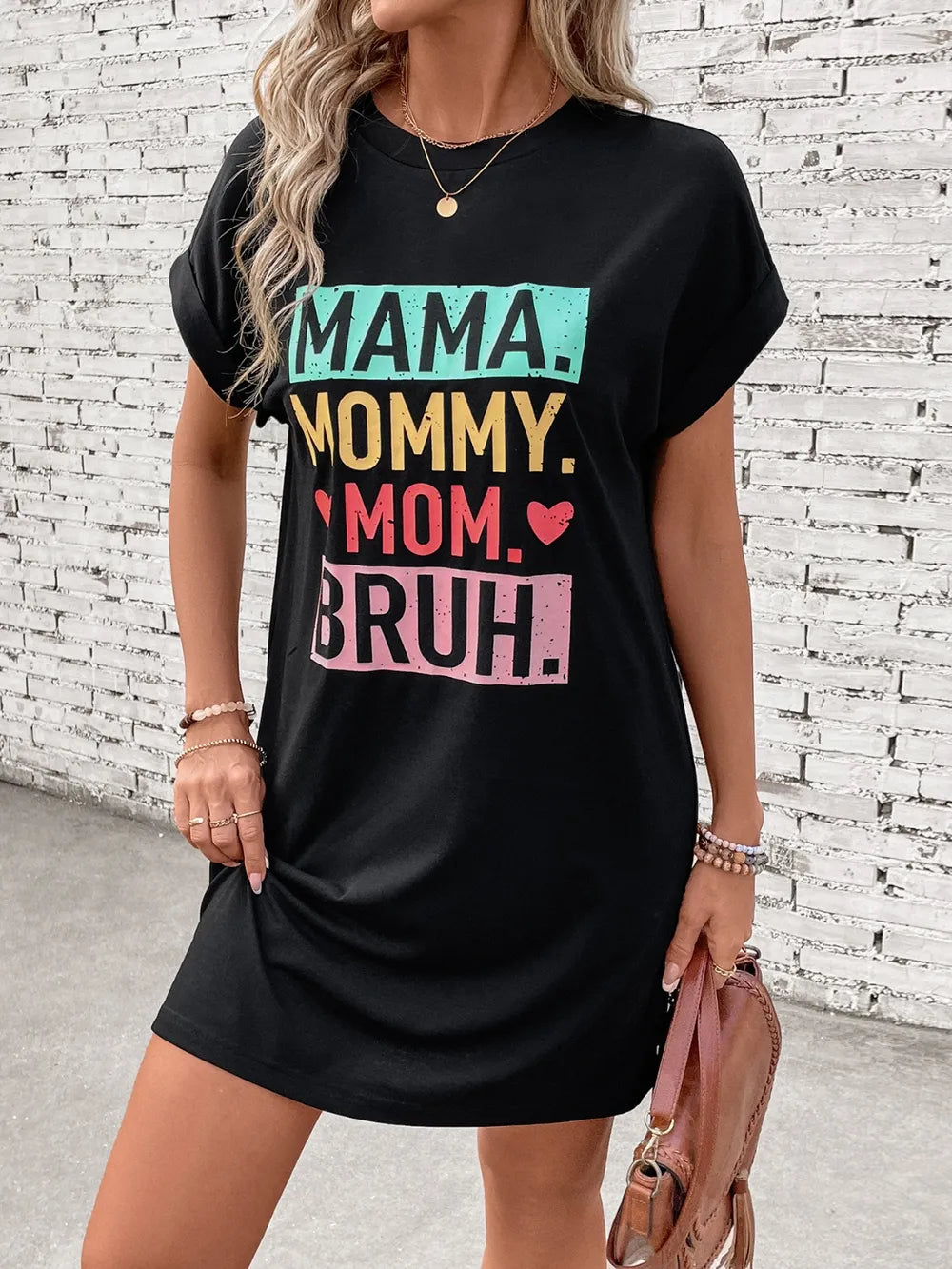 Black graphic tee dress with Mama Mommy Mom Bruh text, short sleeves, and crew neck.