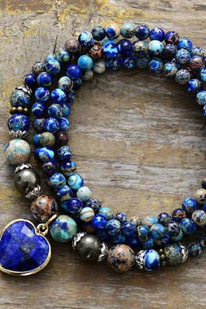 Azure Orb & Heartstone Wrap Bracelet with blue beads and a blue heart charm.