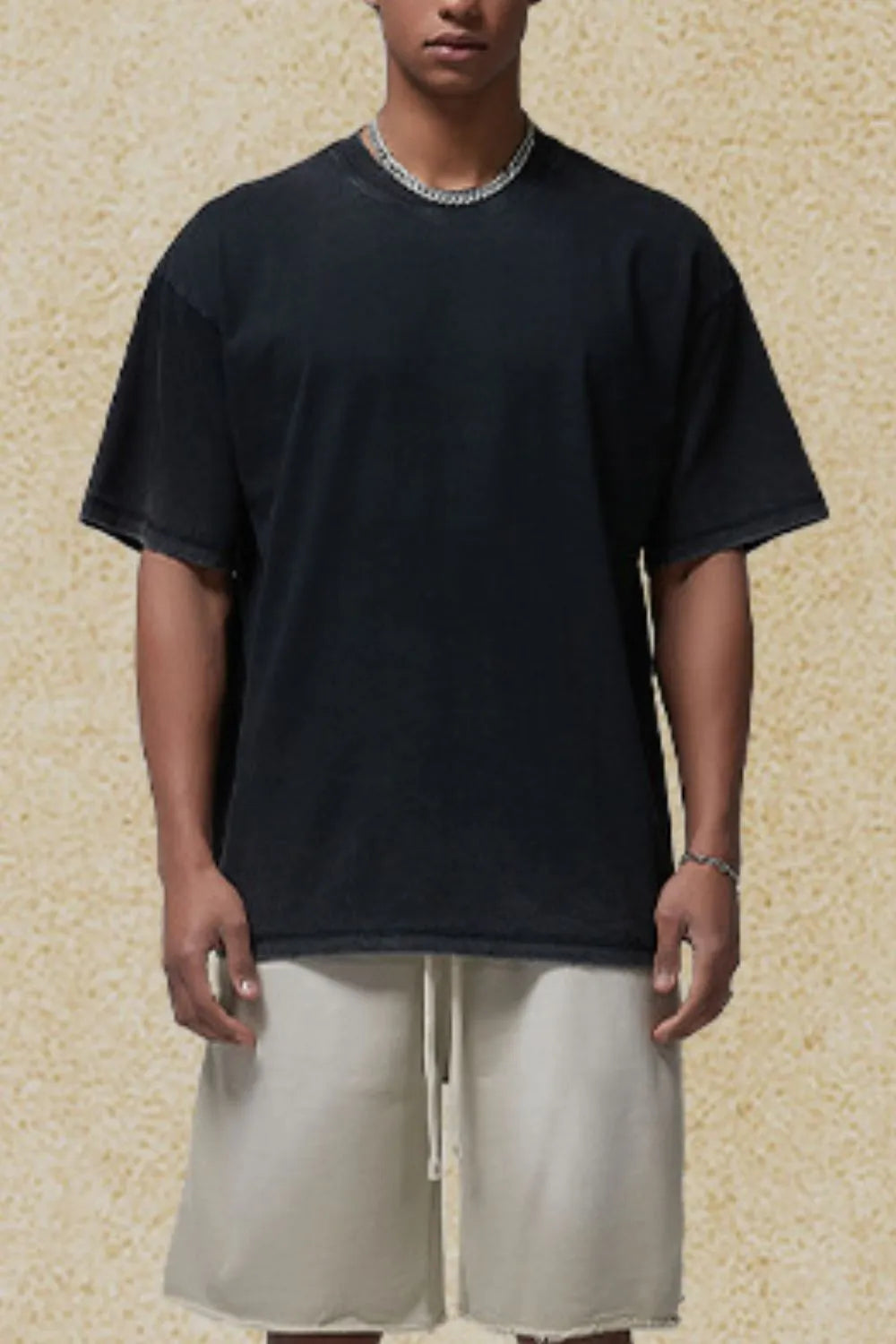 Washed black oversized t-shirt with crew neck and short sleeves.