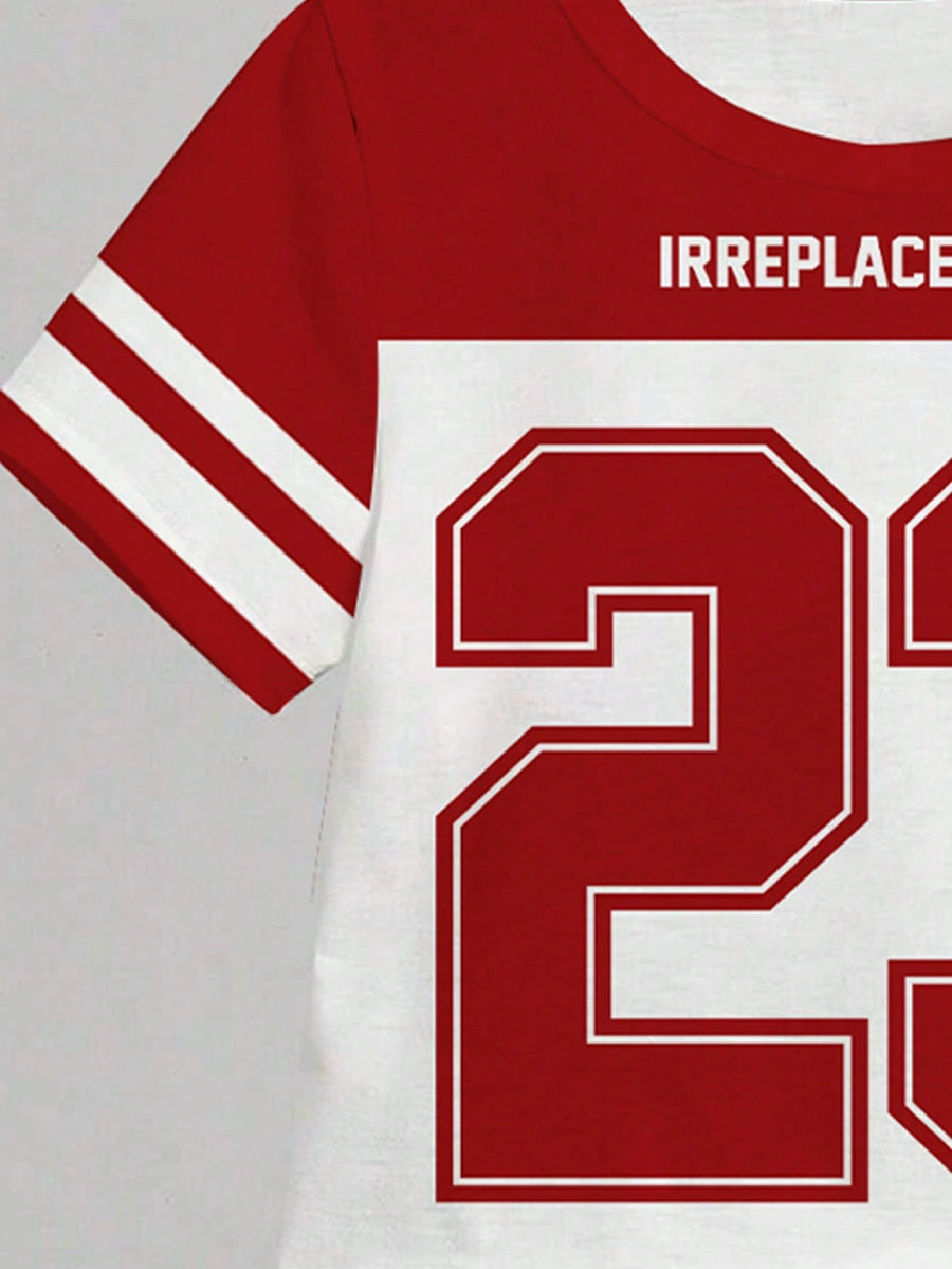 Children's red and white athletic graphic tee with "IRREPLACEABLE" text and large number 2 graphic.