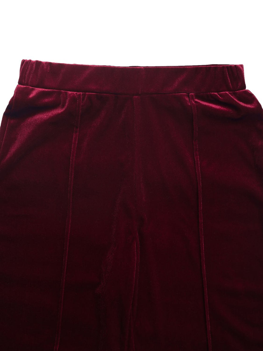 Burgundy velvet palazzo trousers with seam detail and elastic waistband.