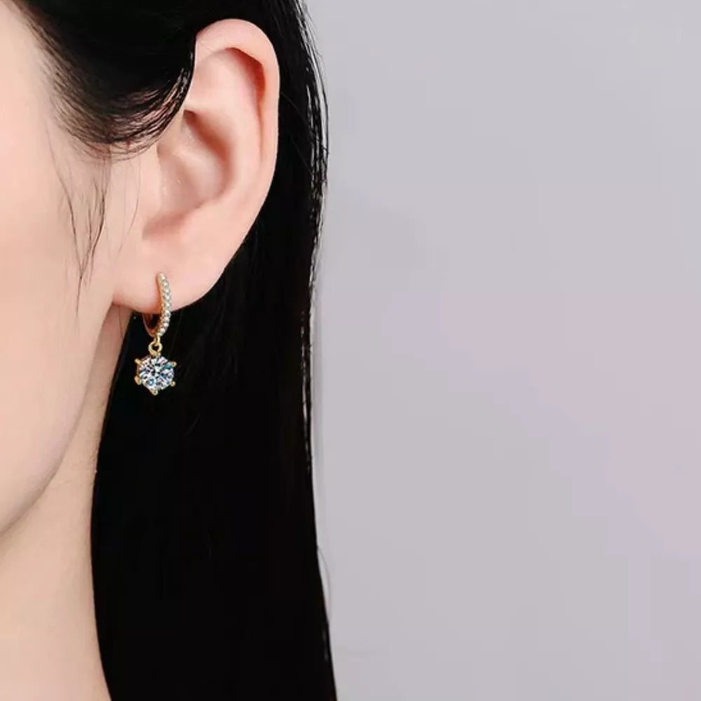 earrings in rose gold featuring moissanite stones and drop fit