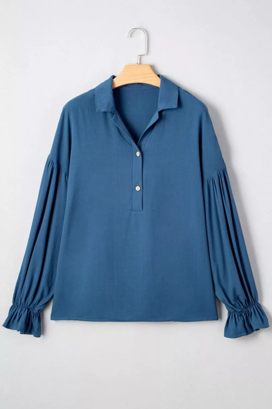 Blue collared shirt with gathered long sleeves and ruffled cuffs