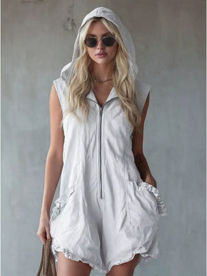White hooded sleeveless romper with ruffled pockets and zip front