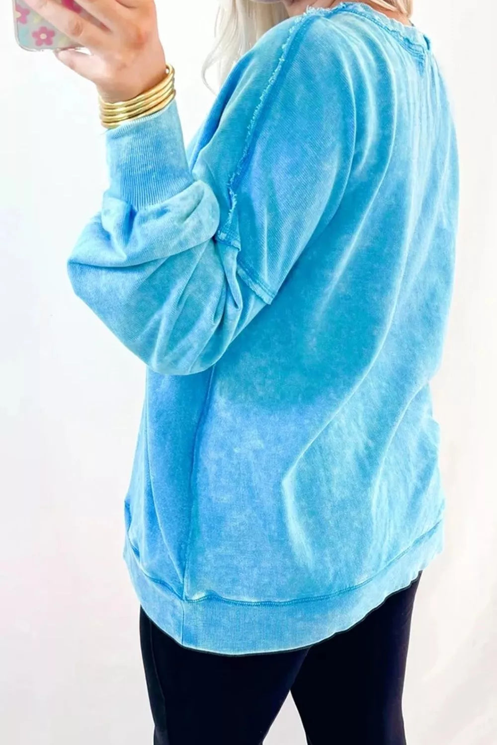 80% cotton, 20% polyester Care instructions: Machine wash cold sweatshirt in Sky Blue with oversized silhouette