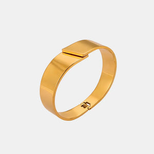 Gold leaf cuff bracelet with a modern clasp closure