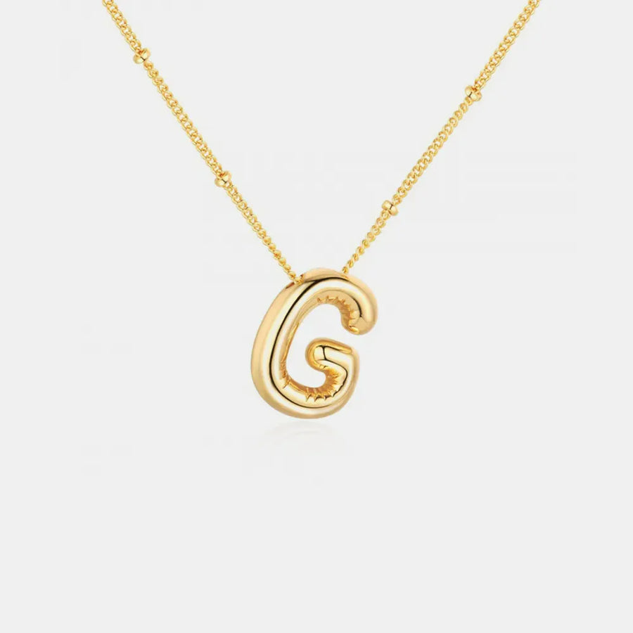 Gold initial pendant necklace with bubble letter G and beaded chain