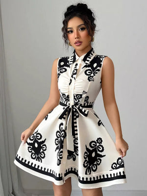 Charming Ruching Tie Waist Dress in black and white print, button-down, collared, sleeveless, A-line skirt.