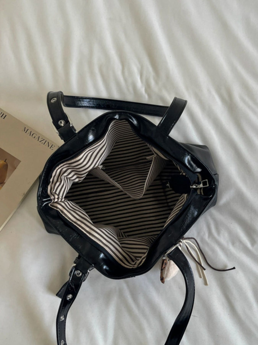 Adjustable-Strap Decorative Buckle Shoulder Bag in Black with adjustable strap