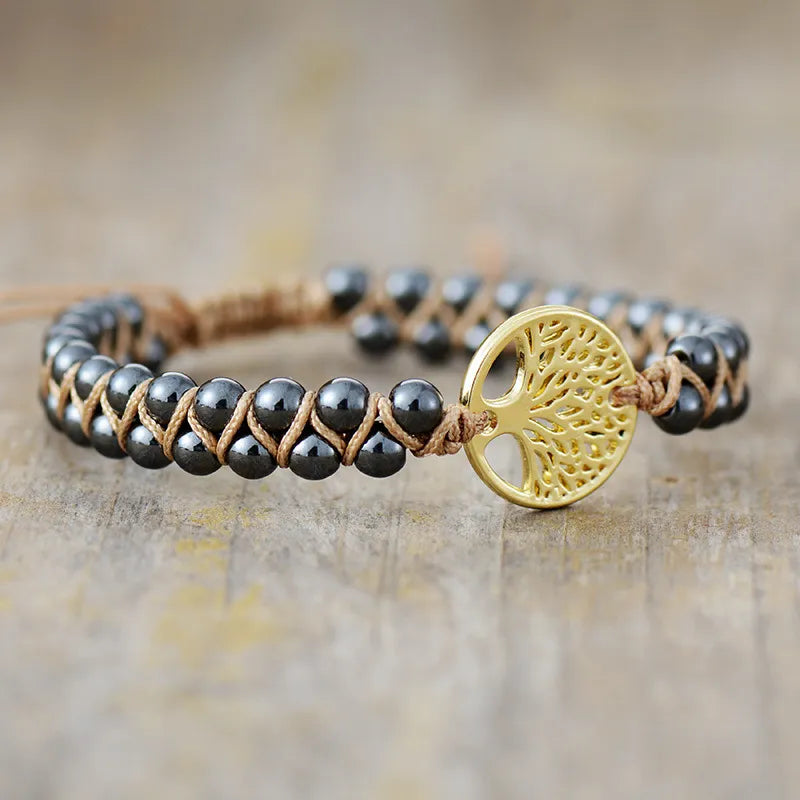 Braided bead bracelet with gold Tree of Life charm on tan cord