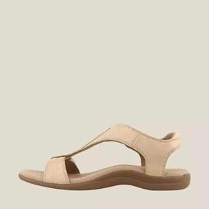 Beige leather T-strap comfort sandals with a contoured sole.
