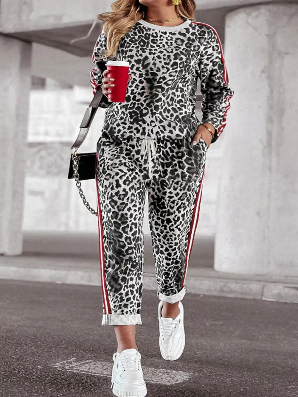 Leopard print plus size two-piece set with red stripe detail, crew neck top and drawstring pants.