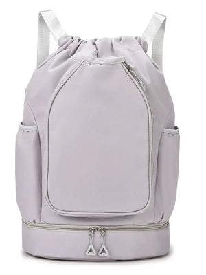 Light gray drawstring duffle bag with zippered bottom compartment and side pockets.