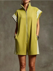 Sporty striped zip-up romper in mustard yellow with white side stripes and pockets.