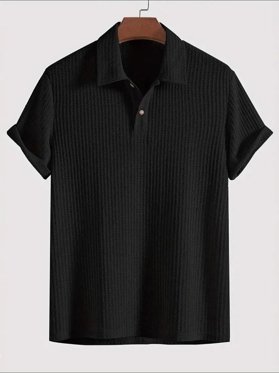 Black textured polo shirt with rolled sleeve detail