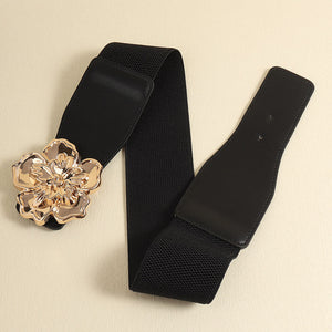 Black elastic cincher belt with gold floral buckle detail