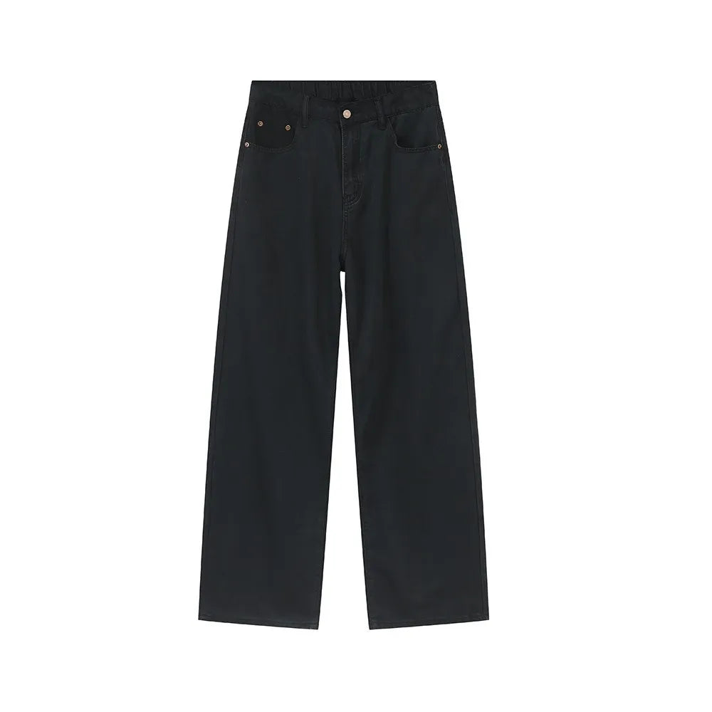 Dark oversized baggy denim trousers with wide legs and a casual fit.
