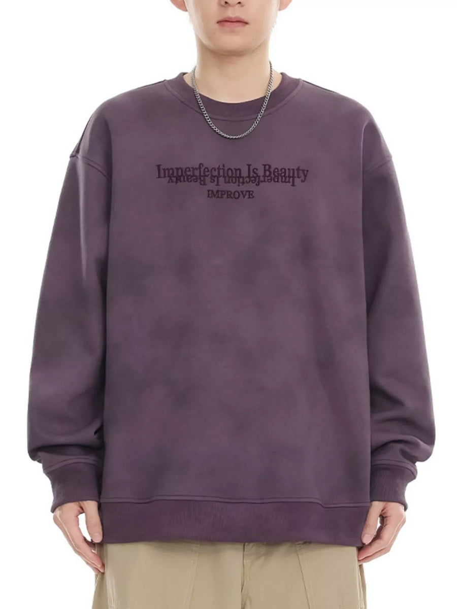 Purple oversized sweatshirt with "Imperfection Is Beauty IMPROVE" graphic print