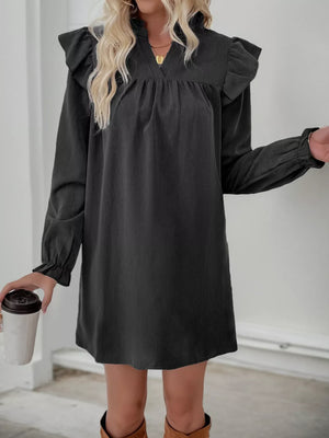 Black ruffled notched sleeve dress with V-neck and cinched cuffs.