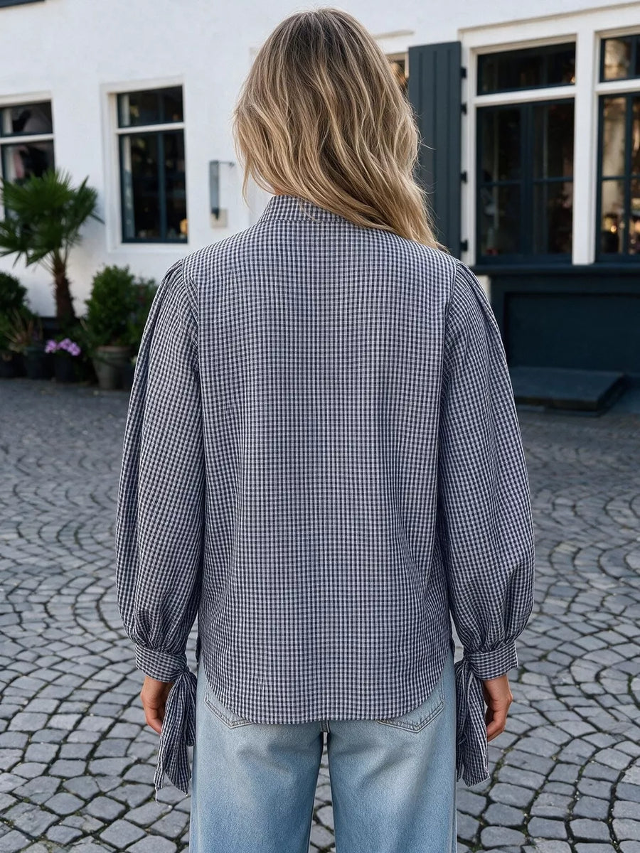 navy blue button-up shirt with button cuffs and long sleeve