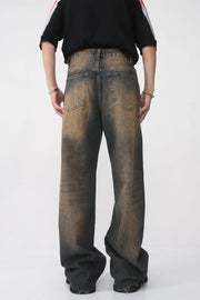 Faded wash wide leg jeans in dark with distressed details.