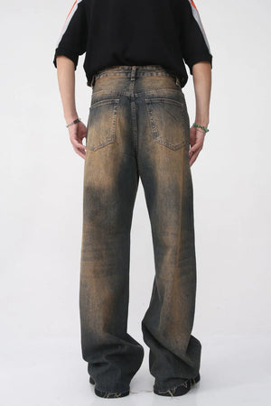 Faded wash wide leg jeans in dark with distressed details.