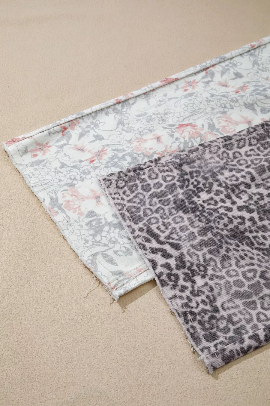 Floral and leopard print wide-leg jeans in cotton with raw hem detail.
